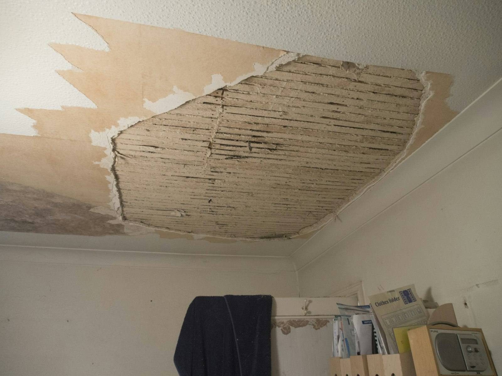 Collapsed ceiling drywall after a water leak in a home